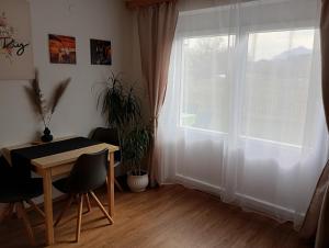 a dining room with a table and a window at SeeSternchen in Faak am See +13 photos