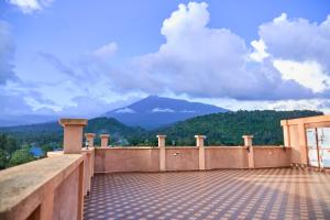 a balcony with a view of a mountain at Sumni Hotel in Nkoanrua
