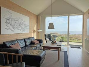 a living room with a couch and a table at 712-Hvide-Sande-Slusen-12 in Hvide Sande