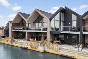 an image of a house on the water at 9928-Hvide-Sande-Langsand-86 in Hvide Sande