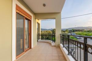 a balcony with a view of the water at LuckyWoodyApartment in (( Kermetés ))