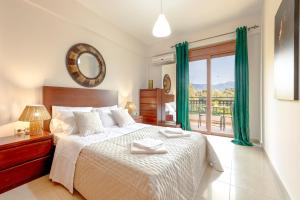 a bedroom with a bed and a large window at LuckyWoodyApartment in (( Kermetés ))