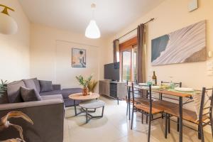 a living room with a couch and a table at LuckyWoodyApartment in (( Kermetés ))