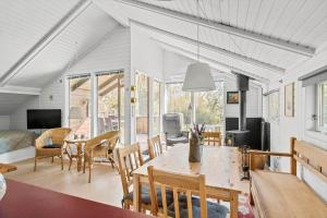a living room with a table and chairs at 3054-Stege-Stejlepladsen-12 in Stege