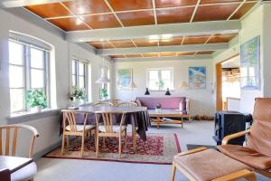 a living room with a table and chairs at 6306-Stege-Hjelmvej-24 in Stege