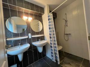 a bathroom with two sinks and a shower at Villa Noach in Durbuy +32 photos