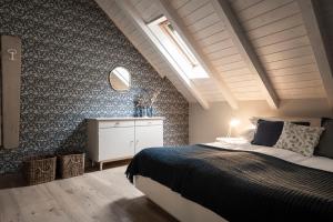 a bedroom with a large bed and a mirror at Bogen bistro & apartments in Bolzano +43 photos