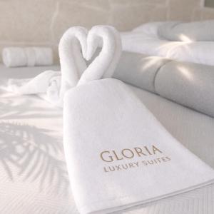two swan towels on top of a bed at Gloria Luxury Suites in Kallithea Halkidikis