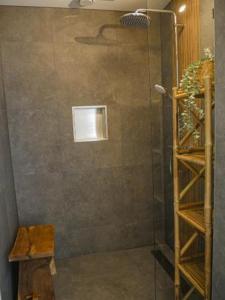 a shower in a bathroom with a glass door at De Kazerne - Kiersche wijde in Wanneperveen