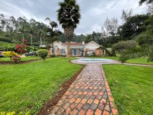 a brick path in front of a house at Angel's place in Kabale