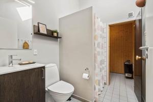 a bathroom with a toilet and a sink at 740-Hvide-Sande-Slusen-40 in Hvide Sande +38 photos