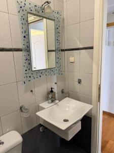 a bathroom with a sink and a mirror at The Sea View kanali in Kanali +13 photos