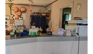 a counter top with some items on it in a kitchen at Holiday Motel Ocala Downtown I-75 in Ocala +15 photos