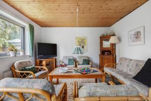 a living room with a couch and a table at 3076-Stege-Rusen-16 in Stege