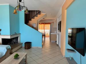 a living room with a blue light on the wall at The Sea View kanali in Kanali