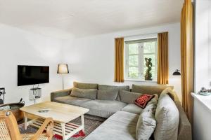 a living room with a couch and a table at 2031-Stege-Ulvshalevej-301 in Stege