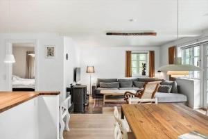 a living room with a couch and a table at 2031-Stege-Ulvshalevej-301 in Stege