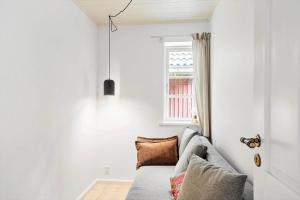 a living room with a couch and a window at 2031-Stege-Ulvshalevej-301 in Stege
