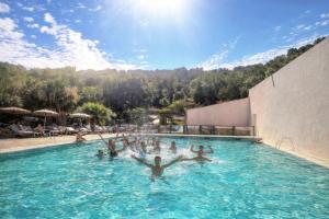 a group of people in a swimming pool at Domaine de Miremer in La Garde-Freinet +55 photos
