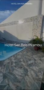 a picture of a stone floor in front of a building at SR Hotel e Pousada Pirambu in Pirambu +6 photos