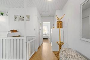 a living room with white walls and a ceiling at 4033-Stege-Kirkebakken-33 in Stege