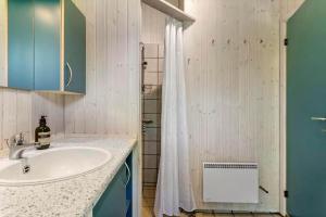 a bathroom with a sink and a shower at 1080-Stege-Berberisvej-48 in Stege