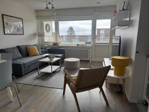 a living room with a couch and a table at Oland Whg 3 Bi de Meere in Wyk auf Föhr