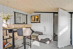 a home office with a desk and a couch at 8223-Vordingborg-Laekrogen-13 in Vordingborg