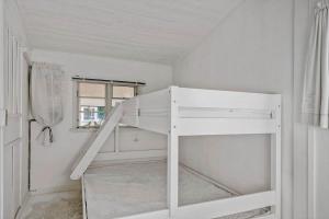 a white bunk bed in a white room at 8223-Vordingborg-Laekrogen-13 in Vordingborg
