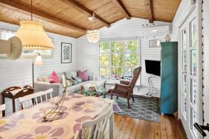 a living room with a table and a couch at 2025-Stege-Ulvshalevej-319 in Stege