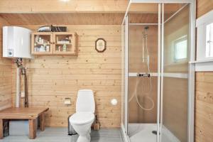 a bathroom with a toilet and a shower at 2025-Stege-Ulvshalevej-319 in Stege +13 photos