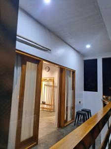 a hallway with sliding glass doors in a room at Second Point View BK in Batukaras