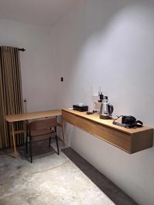 a kitchen with a counter with a tea kettle on it at Second Point View BK in Batukaras