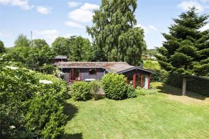 a small house in the middle of a yard at 3055-Stege-Stejlepladsen-23 in Stege