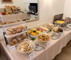 a buffet table with many different types of food at Hotel Ferrara in Cattolica