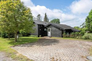 a house with a brick driveway in front of it at 3046-Stege-Paelen-46 in Stege