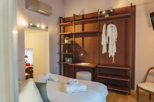a bedroom with a bed with towels on it at Como Prestige Centro Apartment By Icon7 Luxury in Como +144 photos