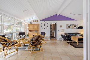 a living room with chairs and a table at HA344-Saeby-Annesvej-1 in Sæby