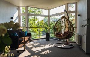 a room with a swing in front of a window at Gościniec CARO in Poznań