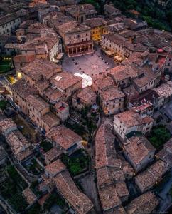 an aerial view of a city with buildings and roofs at Residenza Frontemura in Montefalco