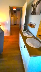 a kitchen with a counter top with a sink at Beachhouse in Eckernförde +39 photos
