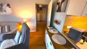 a living room with a couch and a table at Beachhouse in Eckernförde
