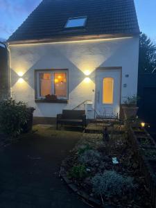 a house with lights on the side of it at Haus Leora in Marpingen