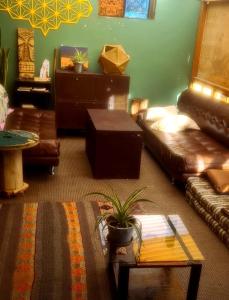 a living room with a couch and a table at Kamanti Hostel in Pisac +89 photos