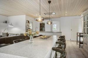 a dining room with a table and chairs at OH532-Hadsund-Avaenget-14 in Hadsund +19 photos