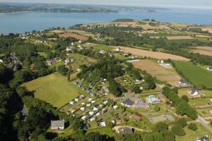 an aerial view of a village by the water at Camping Paradis les Capucines in Trédrez