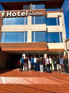 a group of people standing in front of a hotel at Hotel Quitus Airport in Quito