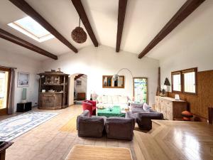 a living room with couches and a table at Villa au calme sans vis à vis in Fayence +11 photos
