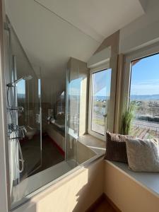 a bathroom with a shower and a window at RebenQuartier in Klüsserath +11 photos
