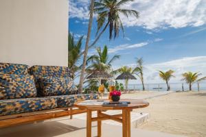 a living room with a couch on the beach at Private Beach Front 2-Bedroom Apartment, Groundfloor in Kiwengwa